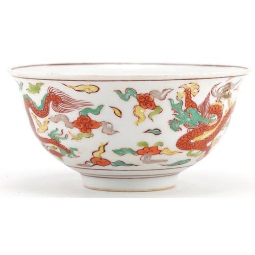 1328 - Chinese porcelain bowl hand painted with dragons amongst clouds, six figure character marks to the b... 