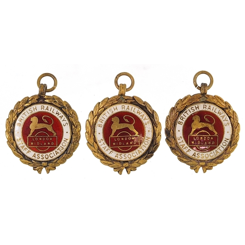 1591 - Three British Railways Staff Association silver gilt and enamel jewels, total 47g