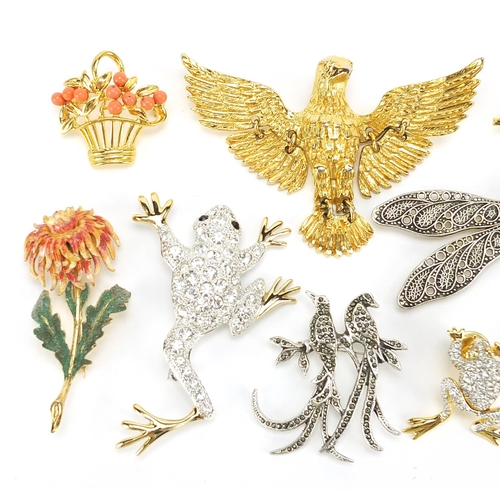 2358 - Nine vintage and later brooches and pins including enamelled flower and marcasite example of two bir... 