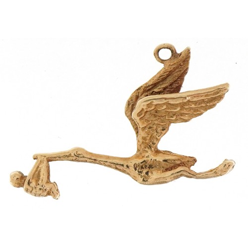 2306 - 9ct gold stork and baby charm, 2.3cm wide, 1.1g