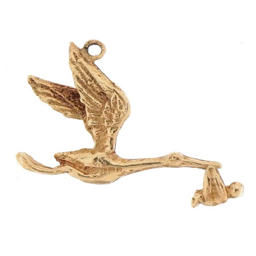 2306 - 9ct gold stork and baby charm, 2.3cm wide, 1.1g