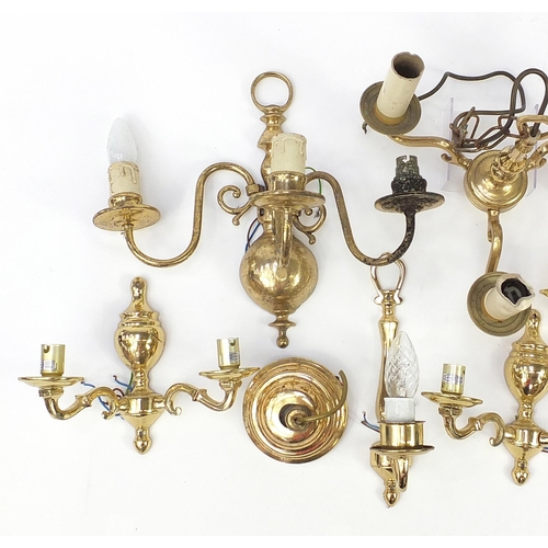 1168 - Seven brass wall sconces including a set of four and a three branch chandelier, the largest 30cm hig... 