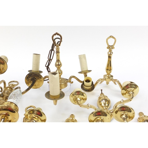 1168 - Seven brass wall sconces including a set of four and a three branch chandelier, the largest 30cm hig... 