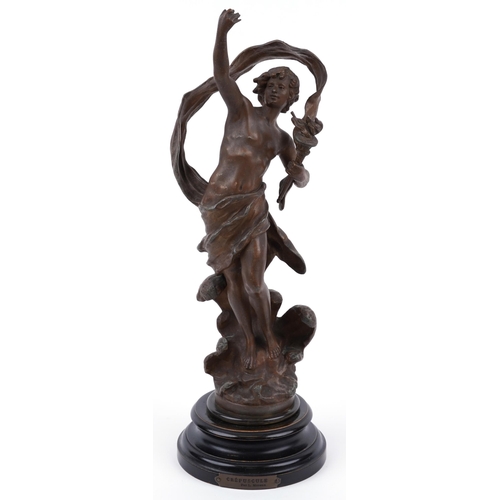 1169 - Patinated spelter study of a nude male holding a flaming torch raised on a circular ebonised base wi... 