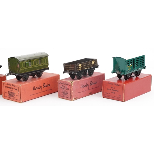1419 - Five Hornby O gauge tinplate model railway wagons with boxes comprising  passenger coach guards Van,... 