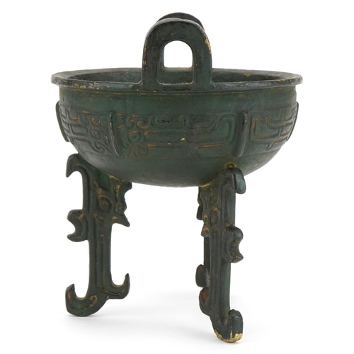 1330 - Chinese archaic style bronzed tripod censer with twin handles, 18cm high