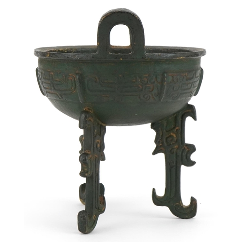 1330 - Chinese archaic style bronzed tripod censer with twin handles, 18cm high