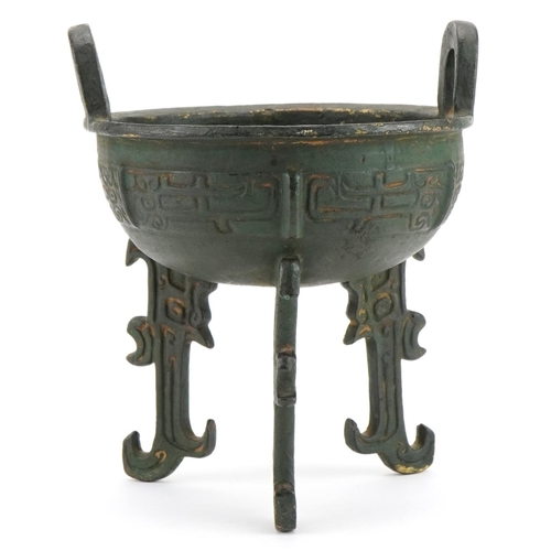 1330 - Chinese archaic style bronzed tripod censer with twin handles, 18cm high