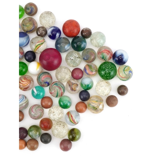 1473 - Collection of 19th century and later glass marbles including latticinio examples, the largest approx... 