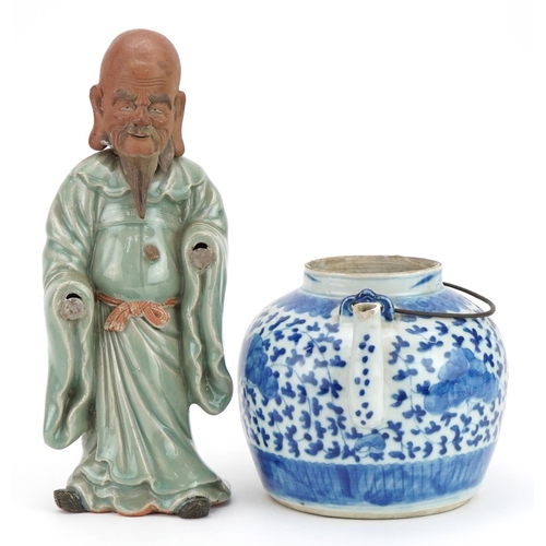 1231 - Chinese blue and white porcelain teapot and a celadon glazed figure, the largest 30cm high