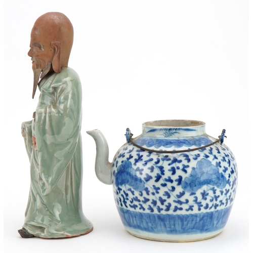 1231 - Chinese blue and white porcelain teapot and a celadon glazed figure, the largest 30cm high