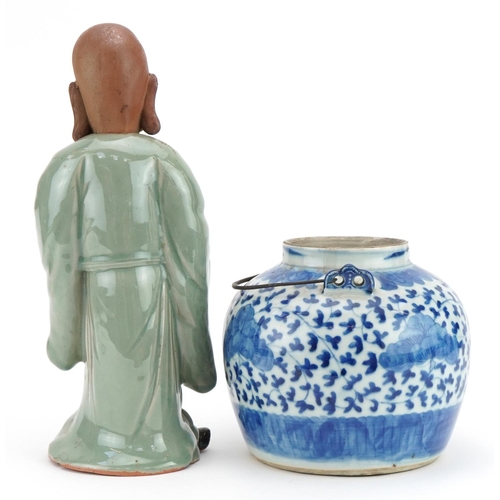 1231 - Chinese blue and white porcelain teapot and a celadon glazed figure, the largest 30cm high