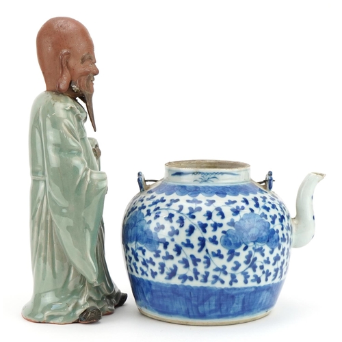 1231 - Chinese blue and white porcelain teapot and a celadon glazed figure, the largest 30cm high