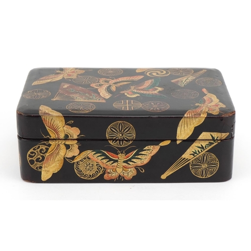 128 - Japanese lacquered box and cover gilded with butterflies amongst fans and stylised roundels, 5cm x 1... 