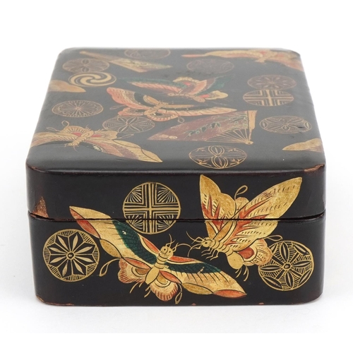 128 - Japanese lacquered box and cover gilded with butterflies amongst fans and stylised roundels, 5cm x 1... 