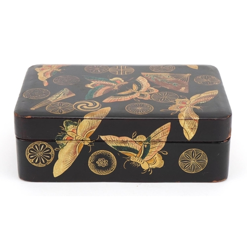 128 - Japanese lacquered box and cover gilded with butterflies amongst fans and stylised roundels, 5cm x 1... 