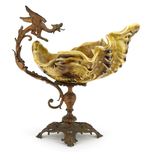 302 - 19th century continental gilt metal centrepiece with dragon handle and pottery shell shaped bowl, 27... 