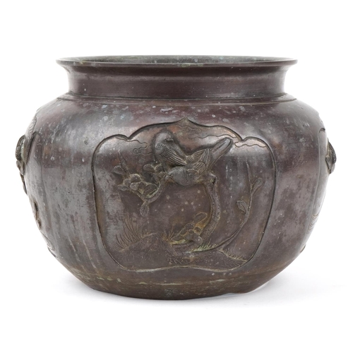 1184 - Japanese patinated bronze jardiniere decorated in relief with birds of paradise, 27cm in diameter