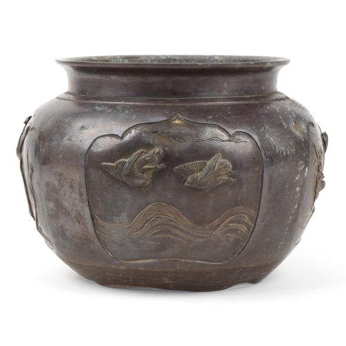 1184 - Japanese patinated bronze jardiniere decorated in relief with birds of paradise, 27cm in diameter