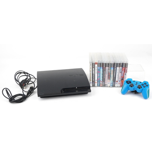 1451 - Sony PlayStation 3 games console with controller and a collection of games