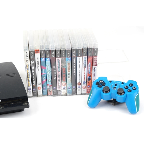 1451 - Sony PlayStation 3 games console with controller and a collection of games