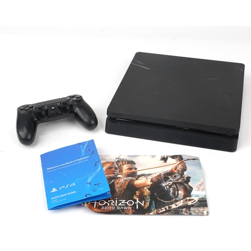 1457 - Sony PlayStation 4 games console with controller