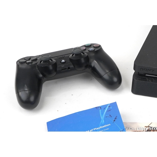 1457 - Sony PlayStation 4 games console with controller