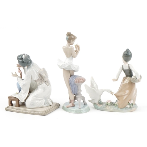 437 - Three Lladro porcelain figurines with boxes including a Geisha girl with a vase of flowers, the larg... 