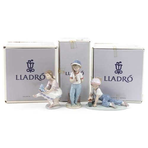 439 - Three Lladro porcelain figures with boxes comprising Boy with Train, Boy with Baseball Bat and Girl ... 