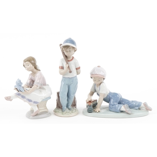 439 - Three Lladro porcelain figures with boxes comprising Boy with Train, Boy with Baseball Bat and Girl ... 