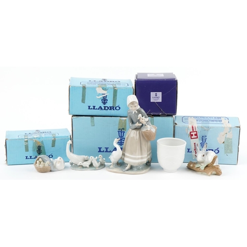 438 - Four Lladro porcelain animals, figures and a bell with boxes, the largest 22cm high