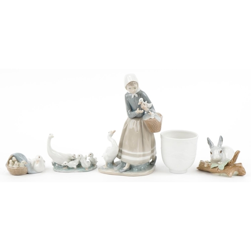 438 - Four Lladro porcelain animals, figures and a bell with boxes, the largest 22cm high