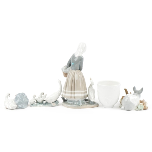 438 - Four Lladro porcelain animals, figures and a bell with boxes, the largest 22cm high