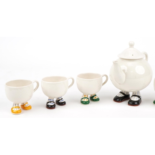 352 - Carltonware Walking teaware comprising teapot and six cups, the largest 21cm in length