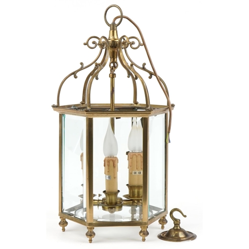 113 - Good quality Gothic style brass hanging three branch lanterns with bevelled glass panels, 55.5cm hig... 