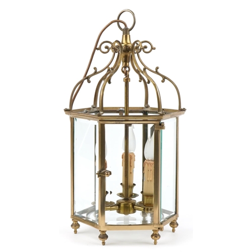 113 - Good quality Gothic style brass hanging three branch lanterns with bevelled glass panels, 55.5cm hig... 