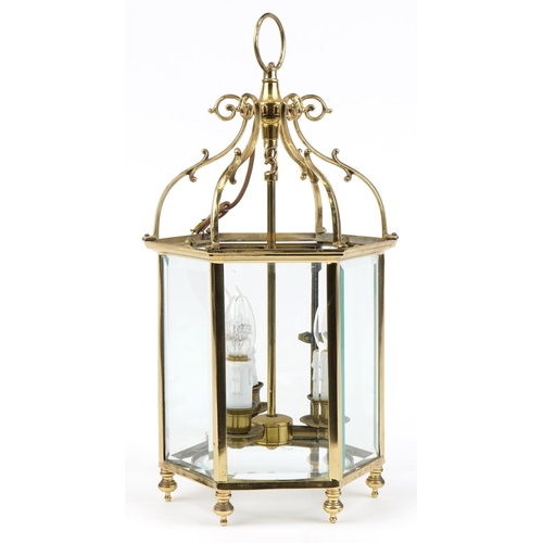 114 - Good quality Gothic style brass hanging three branch lanterns with bevelled glass panels, 58cm high