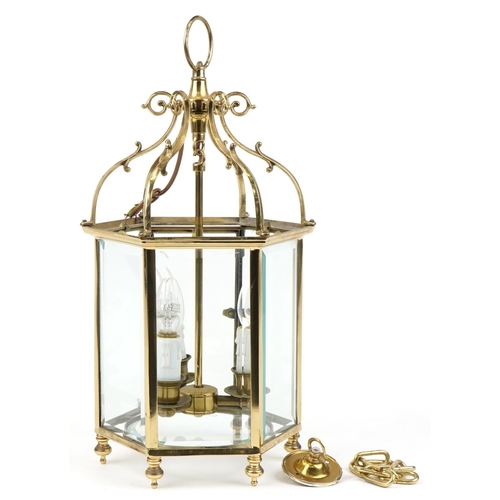 114 - Good quality Gothic style brass hanging three branch lanterns with bevelled glass panels, 58cm high