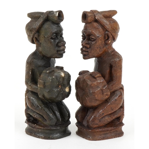 1438 - South African carved stone figural chess set with board, Rhodesia paper label to the base of the che... 