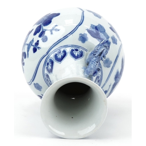 1167 - Chinese blue and white porcelain vase with dragon handles raised on a hardwood stand, decorated with... 