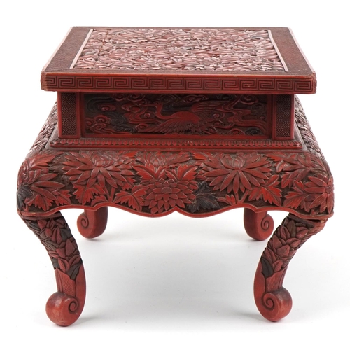 56 - Large Chinese cinnabar lacquered stand profusely carved with chrysanthemums and phoenixes, 26cm H x ... 
