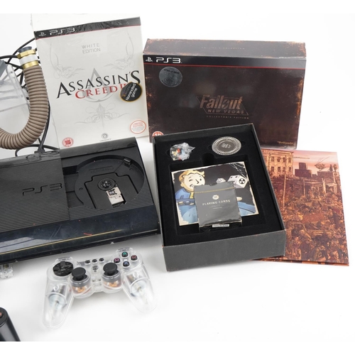 1446 - Two Sony PlayStation 3 games consoles and four Collector's Edition games including Assassin's Creed ... 