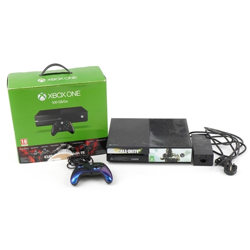 1445 - Xbox One 500GB games console with a controller and box