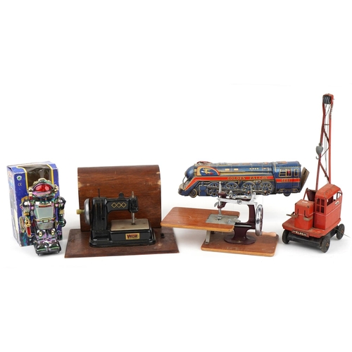 1434 - Vintage toys including a Vulcan sewing machine, Japanese tinplate Golden Falcon locomotive and a Tri... 