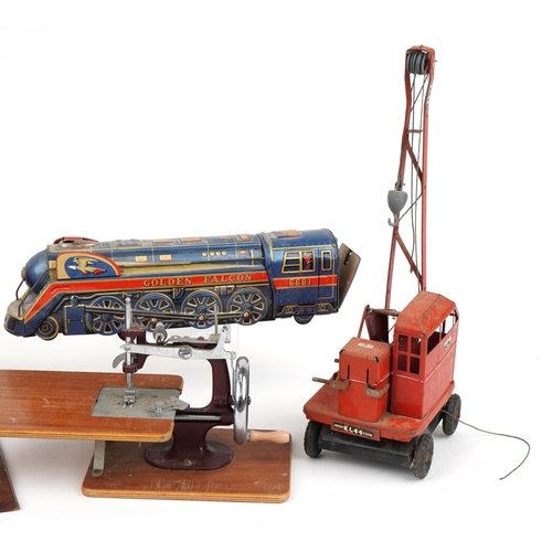 1434 - Vintage toys including a Vulcan sewing machine, Japanese tinplate Golden Falcon locomotive and a Tri... 