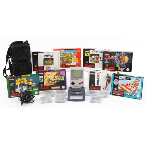 1455 - Collection of Super Nintendo games with boxes and a Nintendo Gameboy with a collection of games