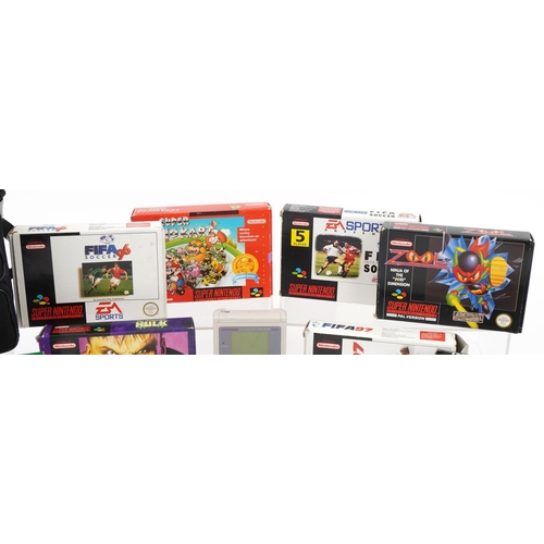 1455 - Collection of Super Nintendo games with boxes and a Nintendo Gameboy with a collection of games