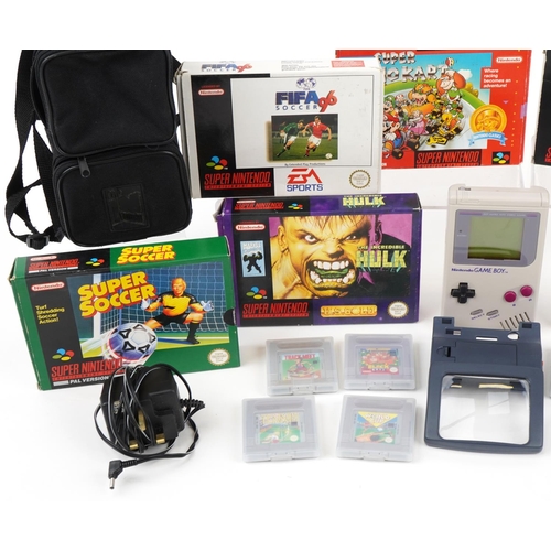 1455 - Collection of Super Nintendo games with boxes and a Nintendo Gameboy with a collection of games