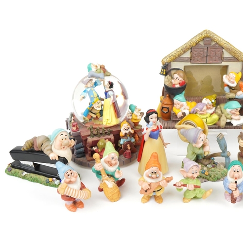 1258 - Collection of Walt Disney porcelain Snow White and the Seven Dwarfs figures including snow globe pho... 