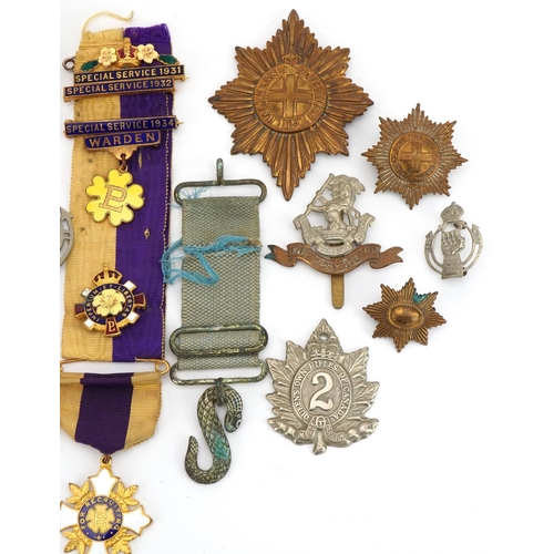 1322 - Military and commemorative interest sundry items including The West Riding cap badge and Queen's Own... 